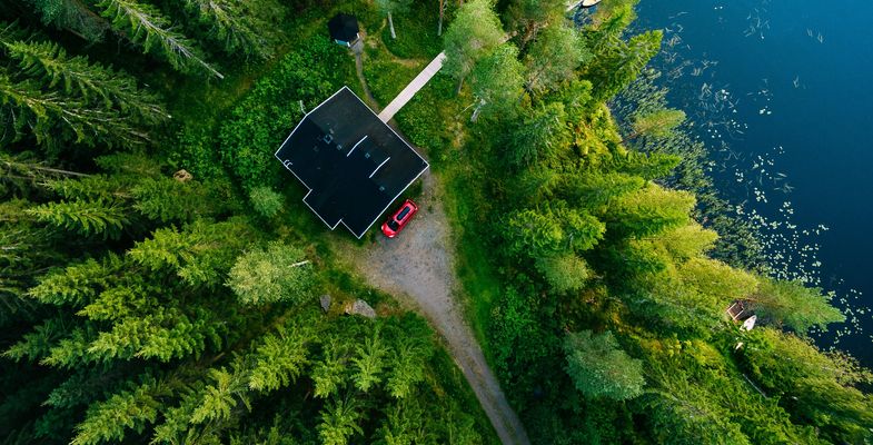 House in forest at lake