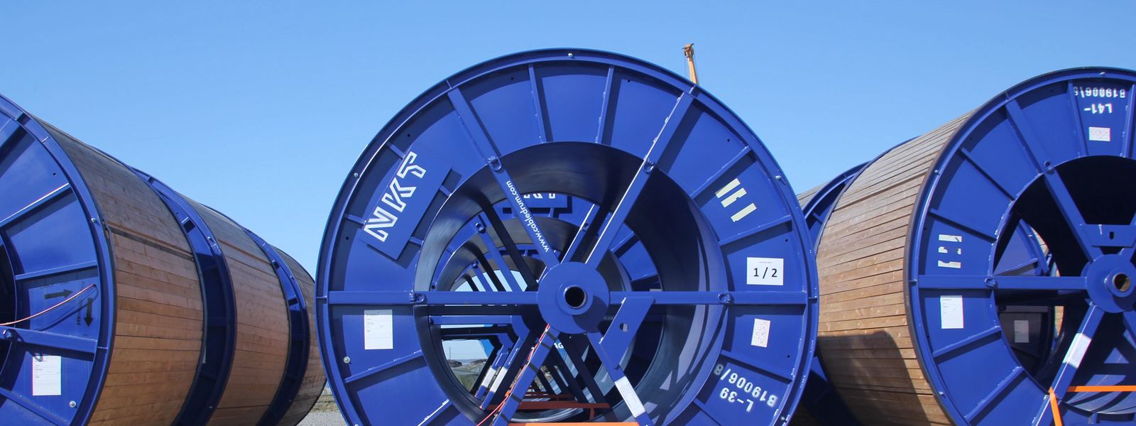 Cable drums under blue sky