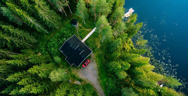 House in forest at lake