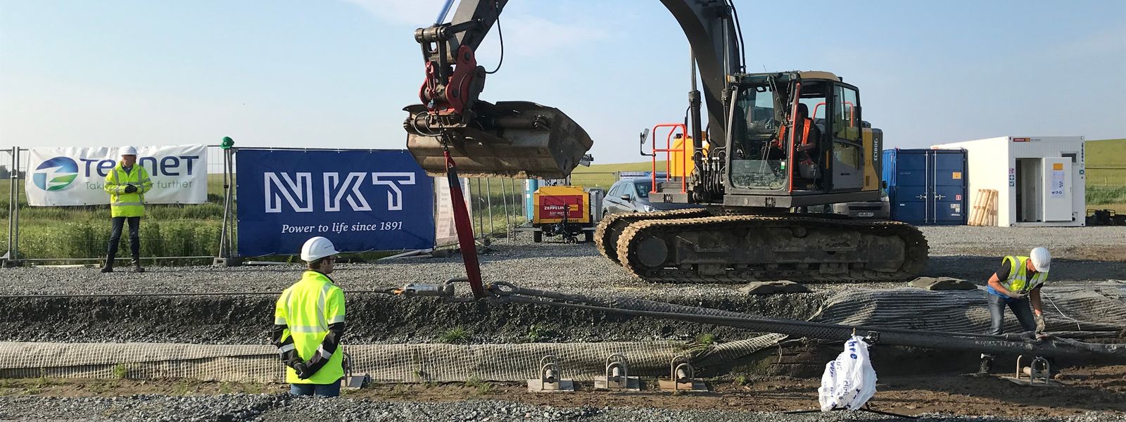 High voltage onshore cable installation with excavator