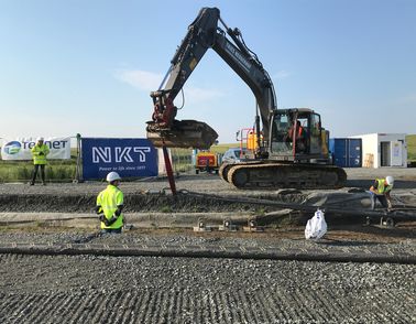 High voltage onshore cable installation with excavator