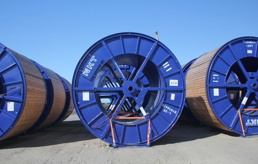 Cable drums under blue sky